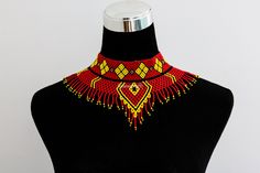 African wedding necklace, Zulu necklace, Beaded shawl necklace, African jewelry, Masai necklace, Bridesmaid necklace, Wedding gift 100% handmade using fine beads. Closure: ball joint Color: red and yellow 3-5 days delivery via DHL Express The shipping fee is for the first item only and additional item(s) ship for free. To continue shopping click here: timanacrafts.etsy.com Traditional Wedding Necklaces With Bead Caps, Traditional Wedding Necklace With Bead Caps, Handmade Red Beaded Necklaces For Wedding, Handmade Red Bridal Necklace With Round Beads, Handmade Yellow Necklaces For Wedding, Masai Necklace, Zulu Necklace, African Beaded Necklace, Beaded Shawl