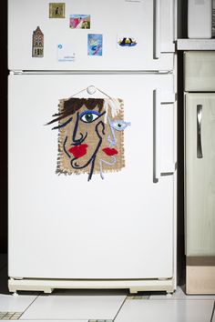 a white refrigerator freezer sitting inside of a kitchen