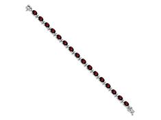 Rhodium over 14k white gold 16 cttw garnet bracelet. Measures approximately 3/16 of an inch in width and has a box catch closure. Elegant Garnet Bracelets For Formal Occasions, Elegant Garnet Gemstone Bracelets, Formal Garnet Gemstone Bracelets, Elegant Garnet Gemstone Bracelet, Classic Red Diamond Bracelet For Formal Occasions, Classic Red Diamond Bracelet For Formal Events, Classic Sterling Silver Gemstone Bracelet For Formal Occasions, Elegant White Gold Garnet Jewelry, Red Fine Jewelry Bracelet For Formal Occasions