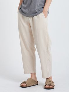 Editor's NotesLinen Cropped Pants Light Beige from PAPERBOY are linen pants made with a relaxed silhouette at the hips. You can adjust the size with a string at the waist. Deformation was minimized through bio-washing. There are pockets on each side and one pocket on one side of the hip.- 15 wt. cotton thread- Pocket details- String detail- High quality fabricMeasurements (in.)- Size: S / M / L / XL- Length: 35.4 / 35.8 / 36.2 / 36.6 in.- Waist: 13.3~16.9 / 14.1~17.7 / 14.9~18.5 / 15.7~19.2 in.- Thigh: 13.7 / 14.1 / 14.5 / 14.9 in.- Crotch: 14.1 / 14.5 / 14.9 / 15.3 in.- Hem: 6.7 / 7.0 / 7.2 / 7.4 in.*Model InformationMan- Height: 6'0 Weight: 132.2 lbs. Size: LWoman- Height: 5'4 Weight: 99.2 lbs. Size: SComposition & Care- 55% Linen, 45% Cotton- Dry Clean OnlyDesigner- by PAPERBOY Comfortable Linen Harem Pants For Spring, Casual Flax-colored Cotton Bottoms, Comfortable Relaxed Fit Linen Harem Pants, Comfortable Linen Harem Pants With Relaxed Fit, Casual Cotton Bottoms In Flax Color, Beige Relaxed Fit Cropped Pants, Comfortable Baggy Linen Pants, Relaxed Fit Ramie Pants For Summer, Summer Relaxed Fit Ramie Pants