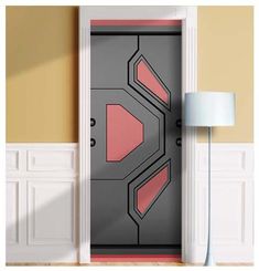 an open door with pink and grey designs on it in a room next to a lamp