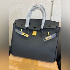 Unbranded Real Leather Handbag. Brand New. Size 35 Small Laptop Fits. Great Work And Travel Handbag High-end Tote Bag With Branded Hardware, High-end Black Bag For Daily Use, High-end Black Bags For Daily Use, High-end Black Bags With Detachable Strap, Light Luxury Leather Bag With Removable Pouch, High-end Black Bag With Removable Pouch, Black Satchel Shoulder Bag Light Luxury, Light Luxury Leather Satchel With Branded Hardware, High-end Black Leather Bags