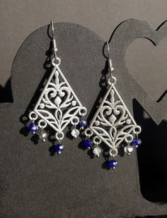 ♥ 10% off when you buy two pairs of earrings. Use code 10OFFTWO at checkout. ♥ Stunning Silver Navy Blue Filigree Earrings, Dark Blue Statement Earrings, Blue and Silver Chandelier Earrings, Blue Boho Hippie Fashion Earrings.  Silver plated ear hooks with silver toned pendant with swirl design.  Please see photos for details. Also available as ear studs or clip on.  The length of the earring is 4 cm (40 mm / 1.5 inches) from the base of the earring hook, and 2.5 cm (25 mm / 1 inch) in width.  Th Blue Teardrop Metal Chandelier Earrings, Blue Nickel-free Elegant Chandelier Earrings, Blue Metal Teardrop Chandelier Earrings, Elegant Blue Pierced Chandelier Earrings, Elegant Blue Nickel-free Chandelier Earrings, Elegant Blue Metal Chandelier Earrings, Blue Metal Chandelier Earrings For Pierced Ears, Blue Metal Chandelier Earrings With Ear Wire, Blue Sterling Silver Nickel-free Chandelier Earrings