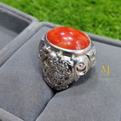 Ring Details - Natural Red Coral - Main Stone Size: 12.00x7.00mm (Approximate) - Ring Front Width: 15.5mm - Band Width: 5.8mm - Band Thickness: 2.00mm - Gross Weight: 15.00 grams - Handmade Ring - Hand-Engraved Design - Sterling Silver 925, Hallmarked - Dimensions and Weight Depend on Variations in Sizes. - Available in all Sizes (Please ensure accurate ring sizing) - DM for Customizations **Note - Our Products are Made to Order According to Customer Expectations, So It May Take Some Time. We Wo Red Oval Enamel Ring For Gift, Oval Red Enamel Ring For Gift, Formal Red Engraved Ring With Polished Finish, Spiritual Ruby Rings In Red, Spiritual Red Ruby Rings, Carved Orange Jewelry For Gifts, Carved Orange Jewelry For Gift, Unique Red Enamel Ring As A Gift, Unique Red Enamel Ring As Gift