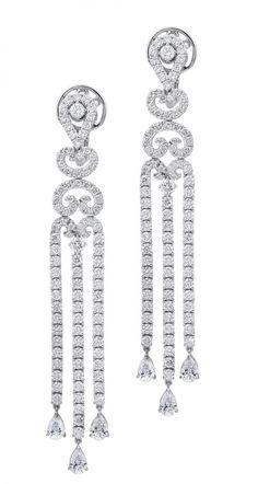 Our 18K White Gold Diamond Earrings are an expertly crafted, eclectic jewelry-box essential. These drop earrings feature a three-strand design created with a combination of round brilliant cut Diamonds alongside pear-shaped Diamonds for elegance and luxury. Eclectic Jewelry, White Gold Diamond Earrings, Gold Diamond Earrings, Pear Shaped Diamond, Round Brilliant Cut Diamond, White Gold Diamonds, Pear Shaped, Round Brilliant, Diamond Bracelet