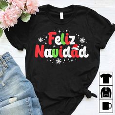 Christmas Shirt, Christmas Outfit Shirt, Christmas Gift, Feliz Navidad Matching Family T-shirt Festive Crew Neck T-shirt With Letter Print, Festive Letter Print Crew Neck T-shirt, Black Christmas T-shirt As Gift, Black Christmas Tops With Text Print, Festive Holiday Letter Print T-shirt, Festive Black T-shirt With Letter Print, Holiday Black T-shirt With Letter Print, Black Text Print Top For Christmas, Black Tops With Text Print For Christmas