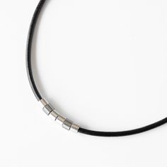 Men's Boho Choker Necklace, Short Black Leather & Silver Plated Tube Beads Necklace for Men, Handmade Minimalist Tribal Jewelry for Guys by Magoo Our trendy, fashionable, and elegant Men's leather choker necklace is exactly what you are looking for when looking for a gift for yourself or a friend, husband, father, or boyfriend.  Great for young or young in spirit, this necklace can be the perfect add-on for any outfit, casual or festive. This choker necklace is made of a black leather cord with Minimalist Leather Jewelry With Adjustable Cord, Minimalist Adjustable Leather Necklace, Adjustable Minimalist Leather Necklace, Minimalist Everyday Leather Necklace, Minimalist Everyday Jewelry With Adjustable Cord, Minimalist Adjustable Necklace For Everyday Use, Minimalist Black Leather Necklace, Adjustable Minimalist Everyday Necklace, Minimalist Necklace With Adjustable Cord For Everyday Use