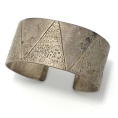 Vintage Signed  Mexico TT-23 925 Sterling Silver  Large wide dementional etched cuff  Bracelet  fit apx sz 7   - see pictures for sizing Weight apx 68.4  g SSB-4 All items are vintage stock and will have varried amounts of patina. I do not polish any of the silver listed so buyer may determine amout of polish. Items may have scuff marks from storage.  Please see all photos for measurements and visual details. Item is new / never worn stock from jewelry store that closed in 2002 Item is described to the best of my ability, items may have tarnish / patina from storage. Any props used in photos are not included unless stated otherwise. I will gladly combine shipping for more than 1 item when possible but must let us know before sending payment. Please visit my ebay store for other items that Vintage Mexico, Bracelets And Charms, Jewelry Store, Vintage Watches, Vintage Signs, Cuff Bracelet, Jewelry Stores, Antique Jewelry, Vintage Antiques