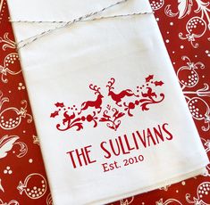 a red and white table cloth with the logo of the sullivans on it