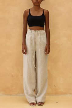 The tie front wide leg pants offer a relaxed fit with an adjustable waist for effortless style. Handcrafted in our studio to your measurements and preferences, available in over 60 colors. DETAILS - 100 % linen, medium weight (200gsm), free-shrinkage, amazingly soft feel - Floor length pants; different length is possible - High waisted - Wide-legs - Front zipper with detachable ties - Inseam pockets - Custom made pants, FREE customizations; simply let us know your needs (hem length, fit style, leg opening width, belt, etc.). - Handcrafted in our studio, French seams, clean and meticulous COLOR - The color shown is Cream. - Available in over 60 colors, choose color in the color chart in the listing. - Link of fabric samples available here: https://madebygaiavn.etsy.com/listing/1399149538 - Relaxed Fit Linen Bottoms With Tie Waist, Linen Bottoms With Tie Waist And Relaxed Fit, Linen Bottoms With Tie Waist And Loose Fit, Relaxed Fit Straight Pants With Tie Waist, Wide Leg Pants With Tie Waist And Relaxed Fit, Linen Bottoms With Tie Waist, Wide Leg Linen Pants With Tie Waist, Linen Straight Pants With Tie Waist, Linen Trousers With Tie Waist