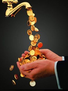 gold coins falling out of a faucet into someone's hand with black background