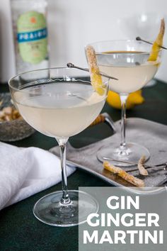 gin and ginger martini with lemon garnish in coupe glasses