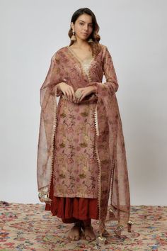 Rust chanderi kurta with floral print and sequins embroidered neckline. Comes with pant, a crushed cotton inner anarkali and an organza dupatta with fringed hem. - Aza Fashions Bollywood Style Straight Kurta For Reception, Zari Work Straight Kurta Palazzo Set For Reception, Bollywood Palazzo Set With Straight Kurta For Reception, Straight Kurta Palazzo Set With Zari Work For Reception, Bollywood Style Jamawar Dupatta For Reception, Traditional Jamawar Salwar Kameez For Reception, Traditional Jamawar Anarkali Set For Reception, Bollywood Chanderi Palazzo Set With Zari Work, Transitional Chanderi Palazzo Set With Zari Work