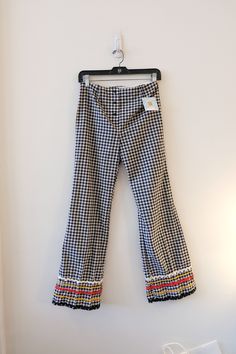 "1970's Vintage Black and White Gingham Low Rise Cotton Bell Bottom Pants Button Front  Low Waisted-size S 27\" waist 30\" inseam Bobbi Brooks *  Low waisted  *  Button Fly  *   No pockets  *  No lining Bell Bottom pant style  *  no waistband  * No synthetic so absolutely no stretch in fabric 27\" Waist, 13.5 at lower abdomen Size 2 Modern 30\" Inseam  16.25\" Hip flat 11\" front rise  11.5\" back rise 10.5\" leg opening flat at hem 1\" Hem 40\" total length 3\" Belt Loops 5\" trim detailing Excellent condition-- Please check out my other items on ETSY. https://www.etsy.com/shop/LulaVintageMN?ref=shop_sugg" Retro Spring Bottoms With Button Closure, Retro Cotton Bottoms With Buttons, Vintage Pants With Buttons For Fall, Vintage Fall Pants With Buttons, Retro Spring Bottoms With Buttons, Retro Bottoms With Button Closure, Retro Style Wide Leg Pants With Button Closure, Retro Wide Leg Pants With Button Closure, Retro Fall Bottoms With Buttons