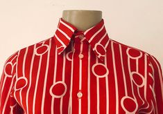 "True vintage top, featuring all over bold red and white geometric pattern, topped with a stately winged collar and classic button up placket. Designer label removed. Approximate Measurements: Shoulder: 14\"; Chest: 35\"; Length: 24.5\"; Labeled a Size 8 Fabric: 100% polyester Eye catching retro blouse, circa 1960s, is in excellent vintage condition. Enjoy! *(International Buyers are welcome - however, please email me so I can check the shipping rate for you before committing to buy.) bt" Retro Fitted Collared Blouse, Retro Fitted Blouse With Collar, Classic Red Fitted Blouse, Red Fitted Collared Shirt, Classic Fitted Red Blouse, Red Collared Top With Retro Print, Red Collared Shirt With Buttons, Retro Fitted Shirt For Office, Retro Fitted Office Shirt