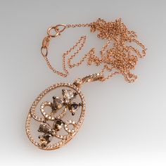 This gorgeous Carlo Viani necklace is crafted of 14k rose gold and features a floral diamond motif. The pendant is set with 6 fancy brown pear cut diamonds, 2 fancy brown round brilliant diamonds, and 94 smaller round brilliant accent diamonds. The total diamond weight is 1.89 carats. The pendant is in excellent condition and hangs from a 14k rose gold 18-inch chain. Ask us about a matching Carlo Viani ring. Luxury Oval Diamond Necklace With Rose Cut, Elegant Brown Necklace For Anniversary, Luxury Rose Gold Diamond Necklace With Rose Cut Diamonds, Elegant Brown Oval Pendant Necklace, Luxury Brown Jewelry With Brilliant Cut, Luxury Brown Gemstone Necklaces, Luxury Brown Brilliant Cut Jewelry, Luxury Rose Cut Diamond Flower Pendant Jewelry, Luxury Brown Diamond Jewelry