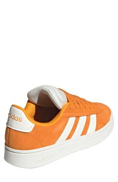 Suede leather adds a classic touch to this tennis-inspired sneaker with modern tech to keep you moving comfortably from day to day. Leather and synthetic upper/textile lining/rubber sole Imported Adidas Orange Leather Sneakers, Casual Tennis Sneakers With Boost Midsole, Tennis Sneakers With Cushioned Footbed And White Sole, Tennis Sneakers With Cushioned Footbed, Sporty Orange Adidas Sneakers, Athleisure Low-top Tennis Sneakers, Low-top Athleisure Tennis Sneakers, Classic Tennis Sneakers With Cushioned Footbed, Classic Orange Sneakers With Rubber Sole