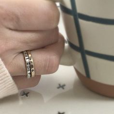 Add a touch of individuality to your jewelry collection with the Typewriter Name Ring from Going Golden. Handcrafted in Brownsburg, Indiana, this ring is perfect for those who love a classic, typewriter-style font. Available in 14K gold-filled, fine silver, or rose gold, this ring offers 100x more solid gold than plated alternatives, ensuring it’s waterproof and tarnish-resistant. Each ring comes with a polishing pad and a gift box, making it a thoughtful gift for someone special or a delightful Everyday Gold Hand Stamped Stackable Rings, Hand Stamped 14k Gold Ring, Hand Stamped 14k Gold Engraved Ring, Hand Stamped 14k Yellow Gold Engraved Ring, Hand Stamped Yellow Gold Engraved Ring For Anniversary, 14k Yellow Gold Hand Stamped Engraved Ring, 14k Yellow Gold Engraved Ring With Hand Stamped Details, Gold Engraved Tarnish-resistant Sterling Silver Ring, Stackable Engraved Rose Gold Ring For Anniversary