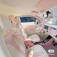 the interior of a pink and white car is decorated with flowers, bunny ears, and other decorations