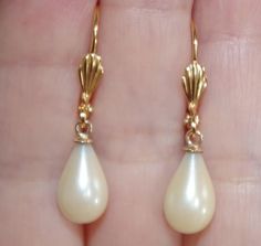 VINTAGE 14K GF 30 MM GOLDEN TEARDROP MAJORCA PEARL LEVERBACK EARRINGS  WELCOME TO MY HANDMADE STORE: HAND MADE 14K GOLD FILLED 30 MM GOLDEN TEAR DROP WHITE / GOLDEN MAJORCA PEARL LEVERBACK EARRINGS THESE EARRINGS ARE FROM HOBE OLD STOCK PEARLS FROM SPAIN. THEY ARE FROM HOBE COMOANY. SOME HAVE DISCOLORATIONS BUT I CLEANED THEM. SOME MIGHT HAVE SOME NOT VIDSIBLE SCRACHES OR MINOR CRACKS ON TOP DRILLS, ON THE UPPER COATING PART WHICH MIGHT NOT BE SEEN ON DRILL PART THEY ARE TRUE MAJORCA FROM SPAIN. WHITE WITH A TONE OF GOLDON COLOR...BEAUTIFUL COLOR IN MY OPINION. SMOOTH SURFACE. THEY ARE OLD STOCK FROM HOBE COMPANY 13 MM  X 8 MM NICE SIZE PEARLS BEADS NICE SIZE DROPS 30 MM TOP TO BOTTOM. PLEASE SEE PHOTOS YOU WILL LOVE WEARING THEM Care Instructions: @ Please Store Your Jewelry In Airtight B Victorian Pearl Drop Earrings For Formal Occasions, Vintage Teardrop Pearl Earrings For Anniversary, Pearl Drop Jewelry, Grad Accessories, White Bead Earrings, Gold And Pearl Earrings, Vintage Pearl Earrings, Gold Teardrop Earrings, Golden Champagne