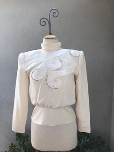 "Vintage evening blazer top cream 100% silk beaded with satin applicants  pad shoulders sz 4 by Gala Julie Francis . Lined and very good condition expect a mild spot ( last photo) . Item has been dry cleaned.  Measured flat Shoulders large pads 17\" Sleeves 23\" Bust 36\" Waist 34\" Lower waist 26\" Hips 32\" Length 23\"" Imperial Beach, Blazer Top, Blouse Silk, Cream Top, Cream Tops, Silk Blouse, Womens Clothing Tops, Victorian Dress, Blouses For Women