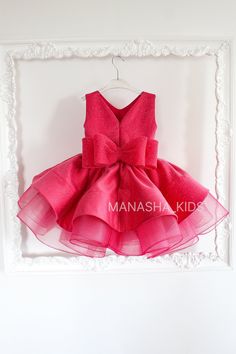 Are you searching for the ideal dress for your little one's special events? Your search ends here! Our children's party dress is the perfect choice for any celebration. It features a lavish tulle skirt, sleeveless style, and charming tulle bows on the shoulders. The top and peplum are crafted from satin and elegantly decorated with lace. Finished with a zipper closure at the back and a delightful small bow. This dress is suitable for various festive occasions such as birthdays and graduations. I Sleeveless Princess Dress With Bow For Birthday, Sleeveless Dress With Bow For Birthday, Princess Style Party Dress With Bow, Pink Party Dress With Bow, Pink Tulle Dress With Bow, First Birthday Princess Dress With Bow, Princess Style Tutu Dress With Bow For Party, Princess Dress With Bow For First Birthday, Princess Style Dress With Bow For First Birthday