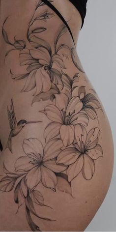 a woman's stomach with flowers on it