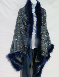 Unique Himalayan Yak/Sheep Wool Blend & Faux Fur Cape/Shawl/Wrap !!!…Ideal Unique Handcrafted gift for you, family, your friends and co-workers…!!! Handloomed/Handcrafted by Artisans Hand Embroidery Stitched Accents that Emphasize the Patterns in the Shawl Design,  Boiled Himalayan Yak/Sheep Wool Blend Shawl Handmade in Nepal Faux Fur | Black & Navy Tribal Design and Pattern A solid color Yak & Sheep Wool Blend of yarns hand loomed shawl in Nepal is handcrafted by a tribal family pattern and Ful Traditional Blue Poncho, Traditional Blue One-size Poncho, Winter Blue One-size Outerwear, Blue One Size Shawl For Winter, Blue One-size Winter Shawl, Blue Fall Shawl, Handmade Blue Shawl For Winter, Embroidered One Size Winter Shawl, One Size Embroidered Winter Shawl