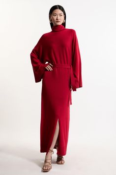 Feel Confident In Our Midi Dress, Made In Knit Fabric, Featuring An Ultra Minimal Design, With A Relaxed, Flowing Fit, Bat Wing Sleeves, And A Belted Waistline. Style It With Block Heels Or Ankle Boots For A Look Perfect For Days Out, Then Wear It With Heeled Boots Or Strappy Heels For An Evening Look. Viscose Blend Funnel Neck Belted Knitted Midi Dress High Quality Viscose Knit Fabric Ultra Relaxed Silhouette Straight Hanging Skirt Statement Bat Wing Sleeves Belted Waistline High, Funnel Neckli