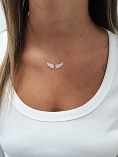 "Handmade rose gold over sterling silver angel wings pendant necklace set with cz zircons, making a simple but elegant statement. The perfect layering piece or minimalist necklace. This necklace is perfect to wear as everyday jewelry and combined layered with other necklaces. Hypoallergenic, lightweight and minimalist. ► FEATURES: * Rose gold plate over sterling silver wings cz pendant necklace. ► MEASUREMENT : Chain length: 15.7\" / 40 cm Pendant width: 1.37\" / 3.5 cm Pendant height: 0.59\" / Fine Jewelry Sterling Silver Charm Necklace With Clavicle Chain, Fine Jewelry Rose Gold Sterling Silver Charm Necklaces, Sterling Silver Charm Necklace With Delicate Chain, Fine Jewelry Sterling Silver Clavicle Chain Necklace, Rose Gold Sterling Silver Clavicle Chain Jewelry, Sterling Silver Fine Jewelry Charm Necklace With Delicate Chain, Rose Gold Sterling Silver Jewelry With Delicate Chain, Dainty Rose Gold Sterling Silver Jewelry, White Sterling Silver Charm Necklace Fine Jewelry