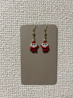 Handcrafted Beaded Santa Earrings - Festive Holiday Jewelry Get into the festive spirit with these adorable handcrafted Santa earrings! Made with intricate beadwork, these earrings feature a cute Santa Claus design. The earrings are lightweight and perfect for adding a playful touch to your holiday outfit. Each earring hangs from a delicate gold-tone hook, making them easy to wear for holiday parties, family gatherings, or as a fun everyday accessory during the Christmas season. These charming earrings also make a great gift for someone special or a festive treat for yourself! Santa Earrings, Cute Santa Claus, Earring Kit, Cute Santa, Holiday Outfit, Holiday Jewelry, Festive Holiday, Christmas Jewelry, Personalized Accessories