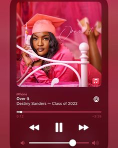 the music player is playing with her graduation cap and gown on it's head