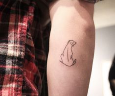 a person with a small tattoo on their arm