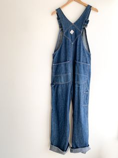 Dark wash, soft denim Penney’s Square Bak overalls. Union made sanforized circa 50/60’s in great condition. Really the perfect pair of overalls. Adjustable straps with original heavy duty metal hardware and buttons. Fabric: DenimLabel: Big Mac Fit: O/S Measurements: Waist 36" Hips 42" Bib width 11" Rise (from top of bib) 25" Inseam 30" Length (at side) 44" Leg opening 10" Condition: Excellent Utility Cotton Denim Jumpsuit With Belt Loops, Utility Style Cotton Denim Jumpsuit With Belt Loops, Dark Wash Utility Denim Jumpsuit With Bib Front, Utility Style Dark Wash Denim Jumpsuit With Bib Front, Utility Washed Overalls For Workwear, Denim Blue Washed Utility Overalls, Washed Blue Denim Utility Overalls, Utility Denim Overalls In Washed Blue, Medium Wash Denim Jumpsuit With Belt Loops