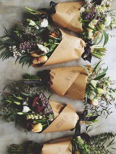 flowers are wrapped in brown paper and tied together