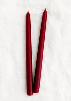 A pair of taper candles in ruby red. Red Taper Candles, Sturbridge Massachusetts, Dripless Taper Candles, Colored Taper Candles, Natural Kitchen, Holiday Tablescapes, Spring Pastels, Candle Sizes, Visual Texture