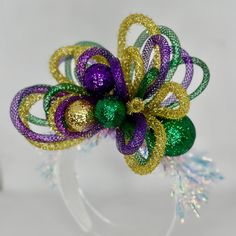 This headpiece screams with energy for all your Mardi Gras activities. Take your Mardi Gras style to the next level with this stunner. Laissez les bon temps rouler *Locally hand made in New Orleans. Headpieces usually ship within 3-5 business days. Please be aware that due to the unique and handmade nature of each product, color, shapes, and sizes may vary slightly from the photo and descriptions. Mardi Gras Headband Headpieces, Mardi Gras Headpiece, Mardi Gras Activities, Mardi Gras Diy, Madi Gras, Mardi Gras Float, Venetian Carnival Masks, Mardi Gras Wreath, Mardi Gras Carnival