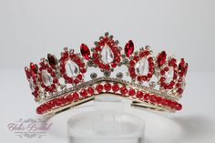 "Beautiful sparkling girl tiara, gold enhanced with red crystals.  Perfect for any occasion. It has a loop at the end of each side to attach it in your hair with bobby pins for added security. Tiara: Approx. 2.75\" tall at its tallest point" Red Crown Jewelry For Wedding, Royal Tall Crown For Wedding, Gold Princess Crown For Wedding, Royal Gold Crown For Parties, Royal Gold Party Crown, Red Round Crown For Party, Red Party Crown, Gold Princess Crown With Pinched Shape, Red Tiara