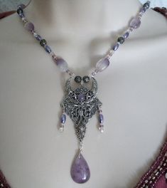 "This beautiful necklace has amethyst beads, Czech glass beads, pearl beads, seed beads, sterling silver plated filigree beads, sterling silver plated filigree crescent moon pendant with amethyst setting and a beautiful amethyst drop. 18\" long. Sterling silver plated toggle clasp." Mystical Handmade Purple Necklace, Handmade Mystical Purple Necklace, Mystical Purple Necklace For Festivals, Mystical Purple Jewelry With Natural Stones, Bohemian Silver Amethyst Beaded Necklace, Purple Amethyst Jewelry For Festival, Purple Gemstone Beads Necklace For Festivals, Bohemian Amethyst Necklaces For Jewelry Making, Bohemian Amethyst Beaded Necklaces For Jewelry Making