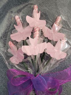 a bouquet of candy canes wrapped in cellophane