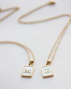 Initial Tag necklace in 14k gold filled with mother of pearl. A personalized necklace that makes the perfect gift for best friends, mother, sisters. Choose your initial or symbol and offer a meaningful gift. Please contact us for more initials. ♥ The chain is made of 14k gold filled and the tag 14k gold over stainless steel. The tag measures 1.2 cm x 1.6 cm. ♥ All of our items come in a lovely gift packaging. ♥ The necklace measures 18 inches long.  * ADD a gemstone on your necklace: http://etsy Elegant White Charm Necklaces As Gift For Mom, Elegant White Charm Necklace As Gift For Mom, Elegant White Charm Necklace For Mom, Elegant White Initial Necklace For Gift, White Initial Pendant Necklace For Anniversary, Mother's Day Personalized White Initial Necklace, Dainty White Charm Necklace For Mom, Mother's Day White Sterling Silver Initial Necklace, White Initial Pendant Charm Necklace For Mother's Day