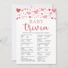 the baby trivia game is shown with hearts in pink and red on white paper