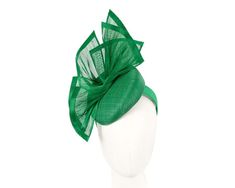 This exclusive fascinator is made right here, in Melbourne, by our experienced milliners. Classic green pillbox base with hand-crafted silk abaca arrangement. It will be a highlight of your spring racing outfit.  Made in Australia  Comfortable headband  Bespoke design Green Fitted Fascinator For Races, Fitted Green Fascinator For Races, Green Headpiece For Evening In Spring, Spring Evening Green Headpieces, Green Mini Hats For Summer Races, Green Mini Hat For Summer Races, Summer Green Mini Hat For Races, Green Fascinator For Royal Ascot, Fitted Green Fascinator For Royal Ascot