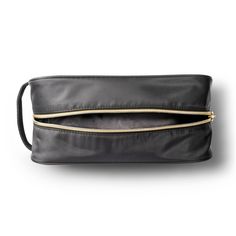 Add functional flair to your travel gear with this sleek and stylish Classic Travel Makeup Bag from Sonia Kashuk™ to take care of all your cosmetic and beauty accessories. The bold black hue and exposed zippers in a champagne gold tone along the top and side lend a chic, modern vibe to your cosmetic collection. Sporting a wide, spacious main compartment, this bag stows away makeup and other accessories in one convenient spot, keeping your suitcase or tote free of clutter. The fabric handle at th Elegant Cosmetic Bag With Zipper For On-the-go, Black Travel Accessories Pouch With Zipper, Black Travel Accessories Pouch With Zipper Closure, Black Travel Pouch With Zipper Closure, Elegant Travel Cosmetic Bag With Zipper, Elegant Cosmetic Bag With Zipper Closure For On-the-go, Versatile Black Cosmetic Bag For Travel, Elegant Travel Cosmetic Bag With Zipper Closure, Elegant Cosmetic Bag With Zipper For Travel