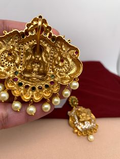 Goddess Lakshmi Big PendentColor : GoldenSize : Pendent Length 2.75 Inches; Earring Length : 2.5 InchesStones : Red Green CZ Stone and Pearls Pendent Set, Goddess Lakshmi, Social Events, Cz Stone, Indian Jewelry, Red Green, Stone, Green, Red