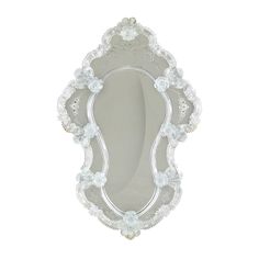 an ornately decorated mirror is shown against a white background