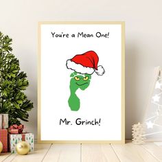 a christmas card with an image of a grin face wearing a santa hat and the words, you're a mean one mr grin