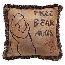 a pillow with a drawing of a bear and the words free bear hugs on it