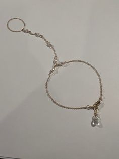 This genuine Pearl hand chain is Stunning and made by hand using genuine Swarovski rhinestones and crystals, 14k gold fill chain and clasp. Made for the Ti Adora by Alvina Valenta 2016 NY Bridal Market and LookBook photoshoot. Typical made for a 7" long hand (wrist to top of center finger):6.5" in wrist circumference with .5" additional adjustable clasp.3" from wrist up to the ring2.5" in ring loop circumference (non adjustable)Custom length is welcome! Just write in the measurements in the note Elegant Metal Jewelry With Beaded Chain, Elegant Silver Chain Ring, Silver Beaded Chain Pearl Jewelry, Silver Pearl Beaded Chain Jewelry, Silver Pearl Jewelry With Beaded Chain, Silver Beaded Pearl Jewelry, Rondelle Pearl Chain Jewelry As Gift, Sterling Silver Chain Jewelry For Party, Sterling Silver Pearl Chain Jewelry For Party