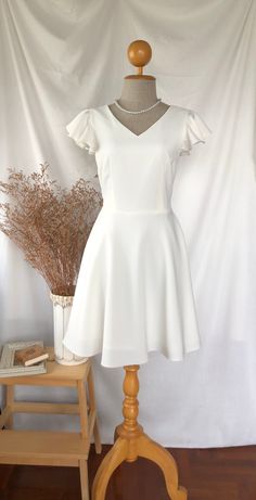 *DHL shipping upgrade is available at check out process. Shipping part by DHL will take 3-6 days only. Production time may take around 2-3 weeks. If this is in rush you can convo us to make it sooner.:) New in:) Alita dress in white. A sweet feminine look party dress which featured ruffle at sleeve, V shape neck bust line with flare swing skirt shape. This is lovely one for formal work teaming with a high heel or wear to a perfect summer day out to town. This is for all, grab one and you will in love with this dress.  Also custom length for this dress is available please convo. DESIGN✄: -Ruffle sleeve. -V neck. -Back zipper. -Swing skirt. -Fully Lining. -Longer length (requestable) please convo MATERIAL✄: *Amena fabric  (Polyester, bright color, solid shade, flattering one.) *Lining materi Cheap White Dresses For School, Cheap White Sleeveless Party Dress, Affordable White Fitted Shirt Dress, Cheap White Dresses For Cheerleading, Cheap Sweet White Dress, Cheap White Collared Dress, Cheap White Knee-length Sleeveless Dress, Cheap Fun White Dresses, Cheap White Solid Color Dresses